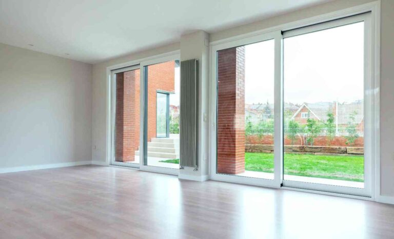 Standard Sliding Glass Door Size showing wide sliding glass patio doors installed in a modern living room with outdoor view access