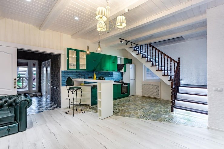 grodno-belarus-august-2019-luxure-hall-interior-loft-flat-grey-style-design-with-green-kitchen-fireplace-chester-sofa-with-stairs_97694-5248