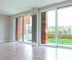 Standard Sliding Glass Door Size showing wide sliding glass patio doors installed in a modern living room with outdoor view access