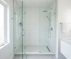 Modern walk-in shower conversion with frameless glass door and white tiles — how much does a tub to shower conversion cost